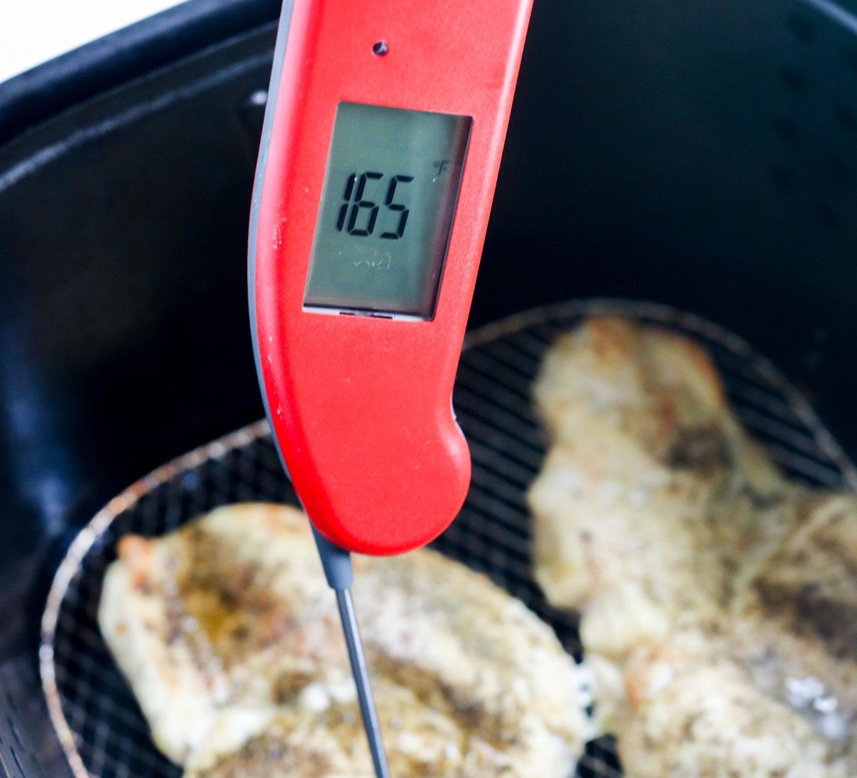 thermometer in chicken showing 165