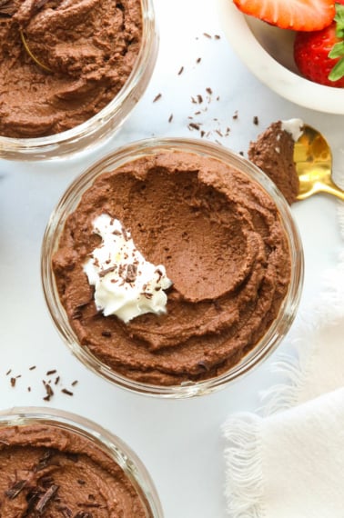 vegan chocolate mousse closeup with spoonful taken out.