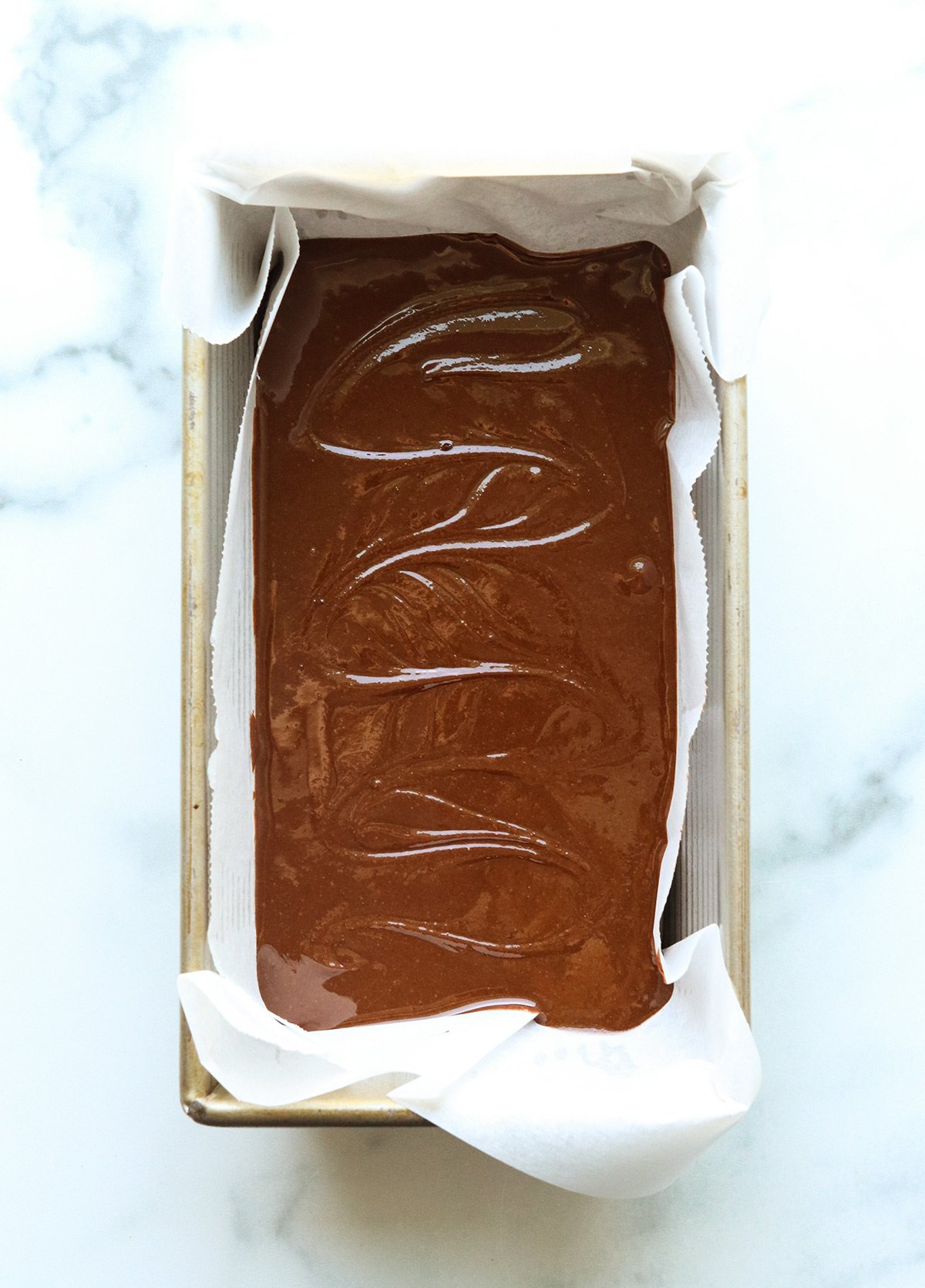 vegan fudge poured into a loaf pan.