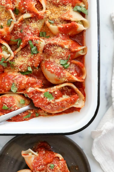 vegan stuffed shells in white baking dish