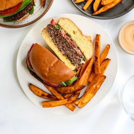 veggie burger cut in half with french fries