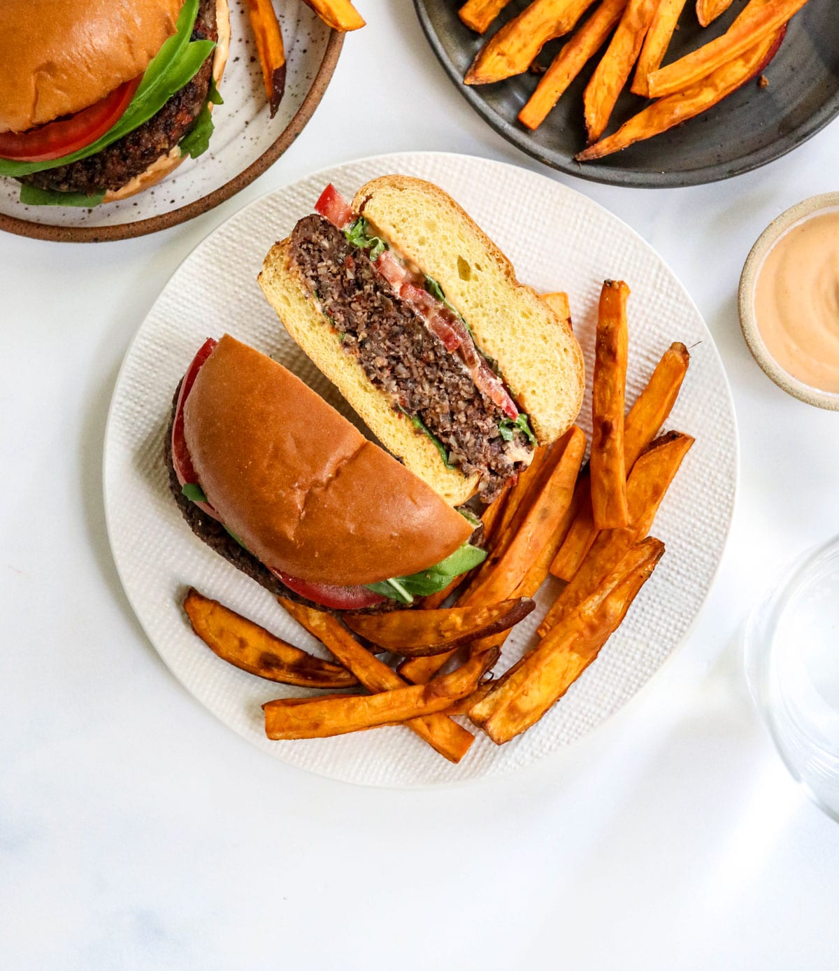 veggie burger cut in half with french fries