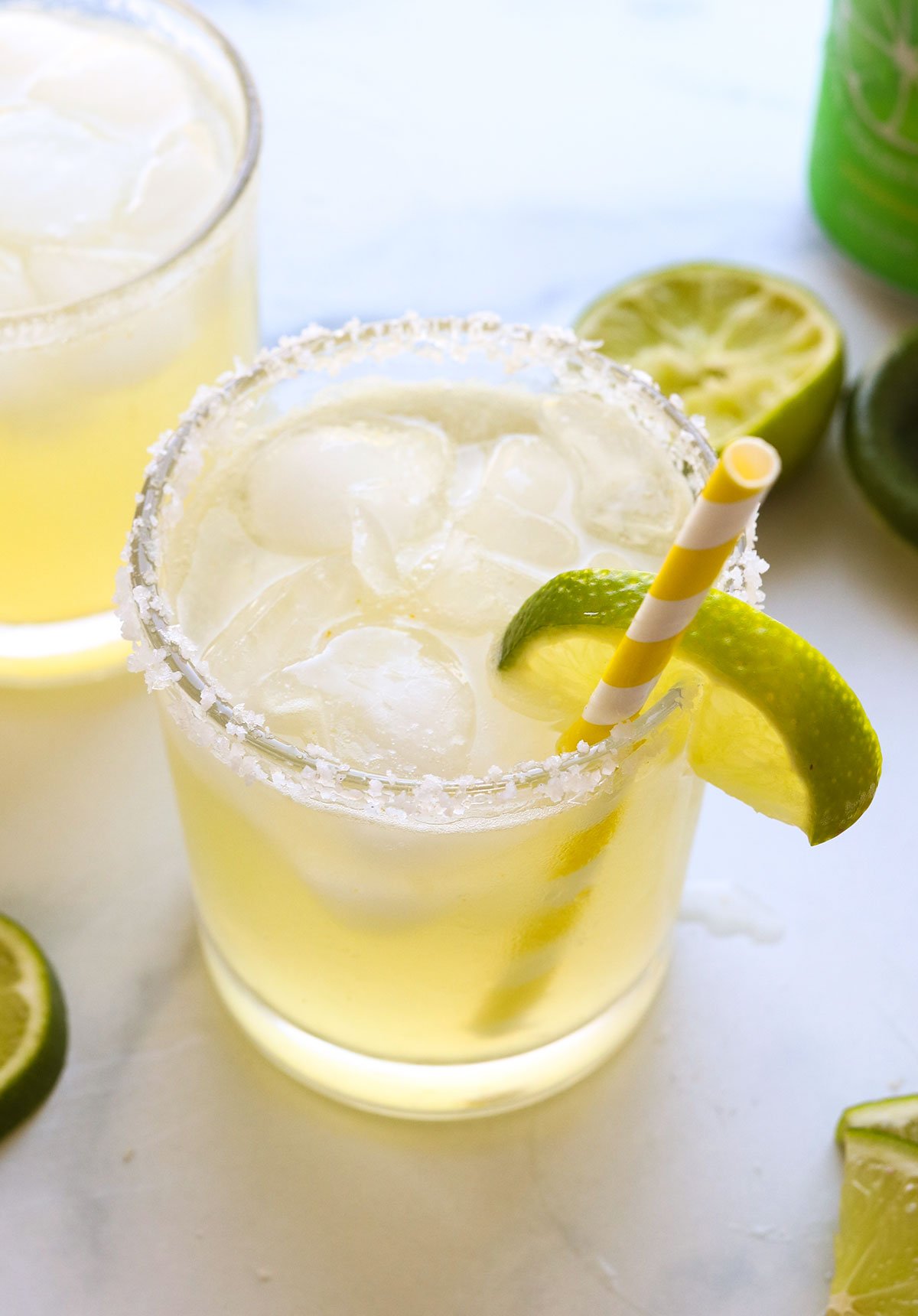 virgin margarita served with a salted rim and a lime wedge.