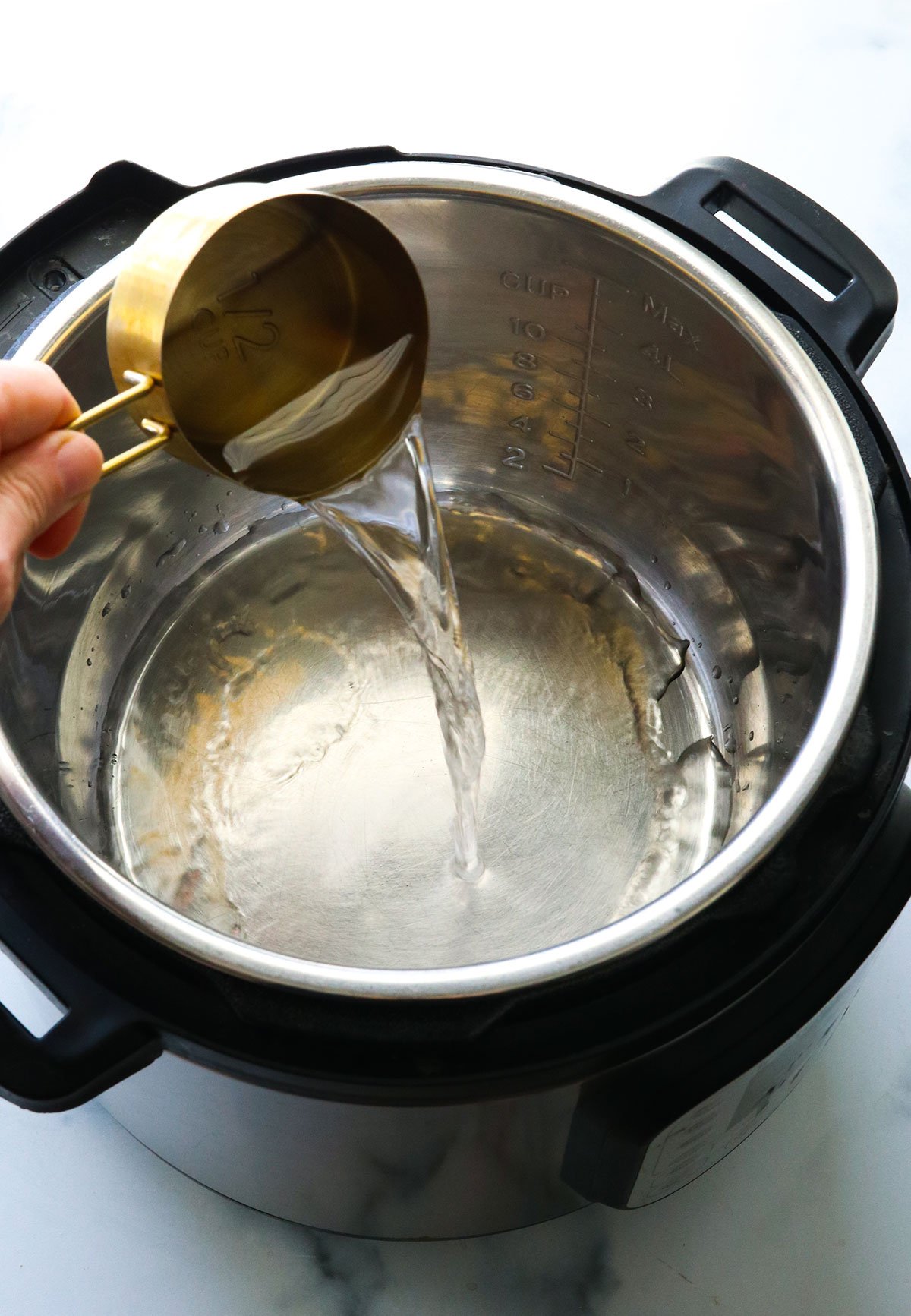 water poured into the bottom of the Instant Pot.