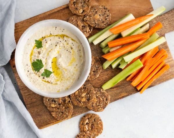 zucchini hummus on a board