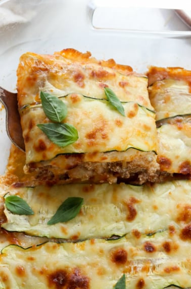 zucchini lasagna slice lifted from pan.