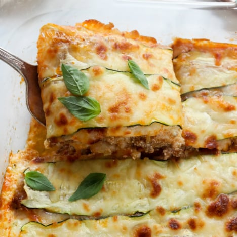 zucchini lasagna slice lifted from pan.